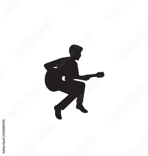 silhouette of a boy playing guitar