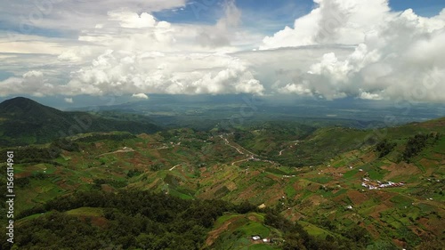 Wallpaper Mural From high above Mount Apo’s foothills, a rich quilt of vegetable terraces, winding roads and forest pockets stretches to the horizon as towering cumulus drift across the bright tropical sky. Torontodigital.ca