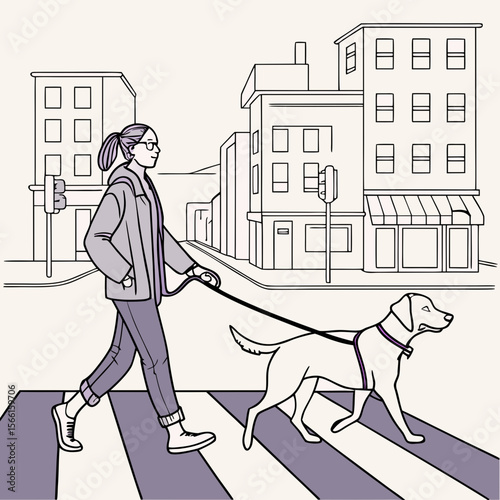 A person walks a dog across a crosswalk in a city with buildings and a traffic light in the background