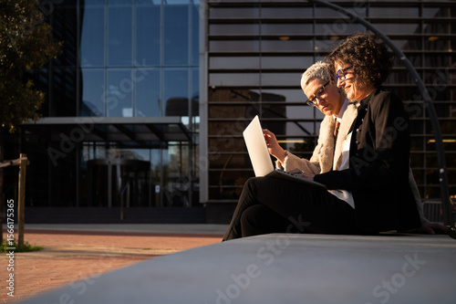 Businesswomen working with laptop in barcelona, spain