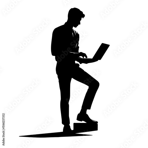 Businessman working on laptop while standing on step in silhouette  