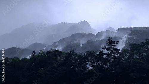 Rainy - Day Waterfall Mountains in New Zealand’s Fiordland