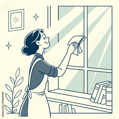 Woman in apron cleaning window with cloth near bookshelf and framed picture on the wall indoors at daytime