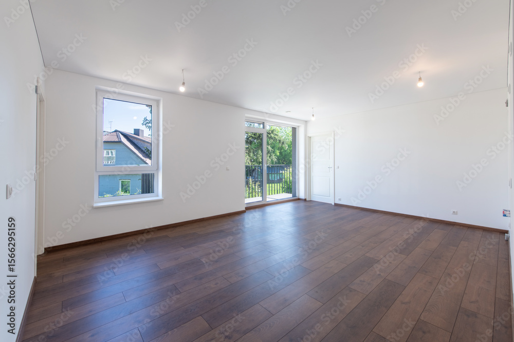 Fototapeta premium Spacious Modern Living Room Interior with Hardwood Floors and White Walls