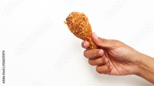 Hand hold fried chicken isolated on white background	