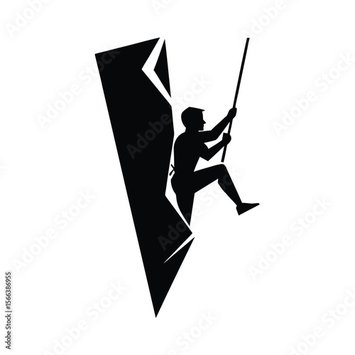 Black silhouette of a mountaineer climbing a rock face