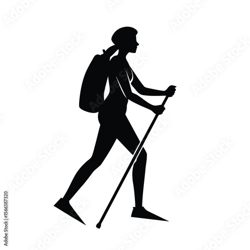 Black silhouette of a woman hiking with a backpack and poles