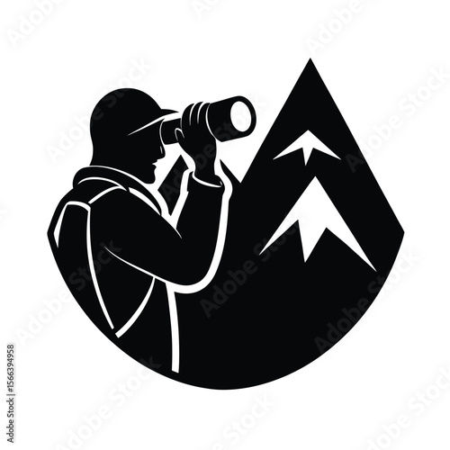 Black silhouette of man with binoculars in front of mountain peaks