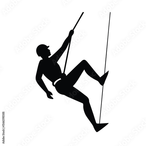 Black silhouette of person rappelling down a rope climbing
