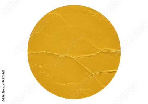 A yellow round sticker with a cracked surface is isolated on transparent background