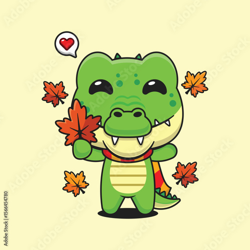 Cute crocodile holding maple leaf in autumn cartoon vector illustration