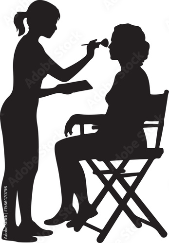 Makeup Artistry Silhouette: The silhouette of a makeup artist applying makeup to a client.