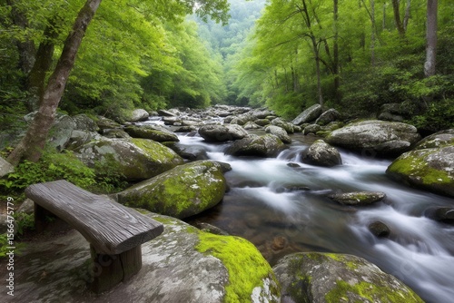 A wooden bench sitting on top of a rock next to a stream
