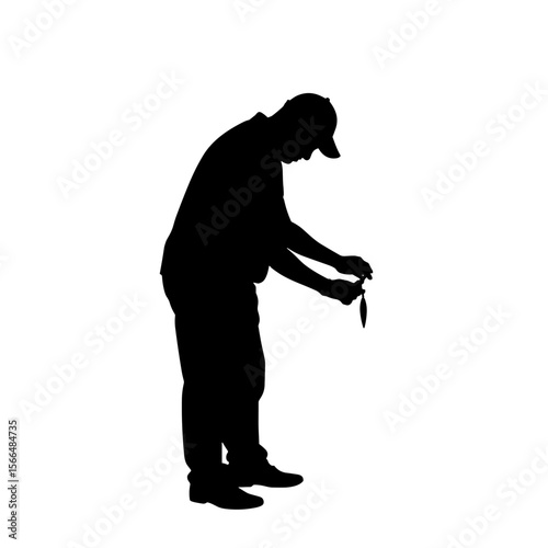 Man fishing and examining catch in silhouette style  