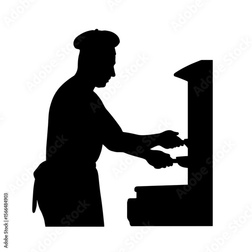 Chef preparing food in silhouette at restaurant kitchen  