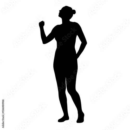 Silhouette of a woman standing confidently with raised fist  