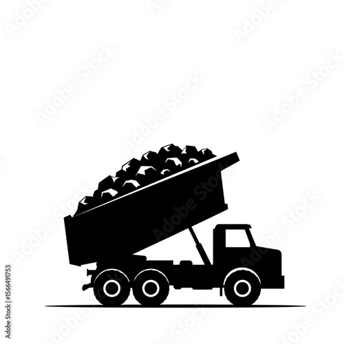 Silhouette of a dump truck loaded with rocks, its bed tilted upwards.