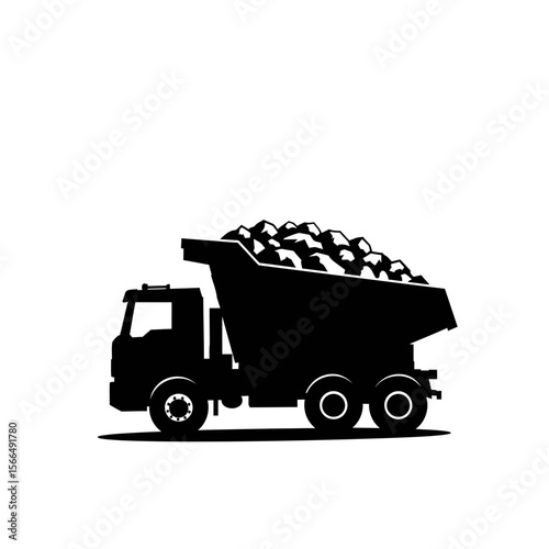 Silhouette of a heavy-duty dump truck transporting a load of rocks.