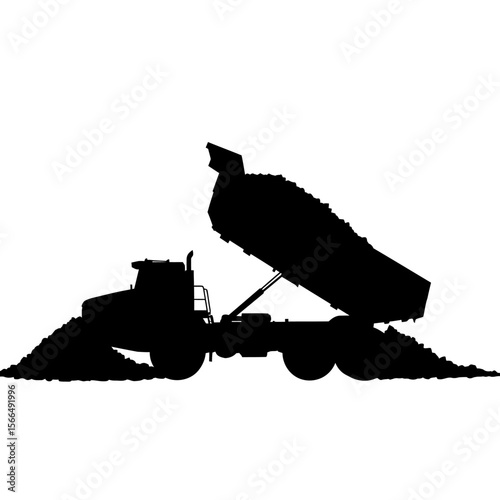 Silhouette of a dump truck unloading its contents onto a pile.