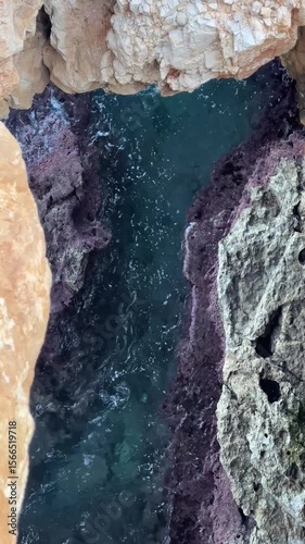 Waves Splashing Gently Between Coastal Rocks