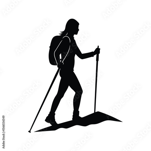 Black silhouette of a woman hiking with poles on snow