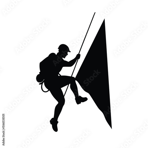 Black silhouette of climber on rock face with rope