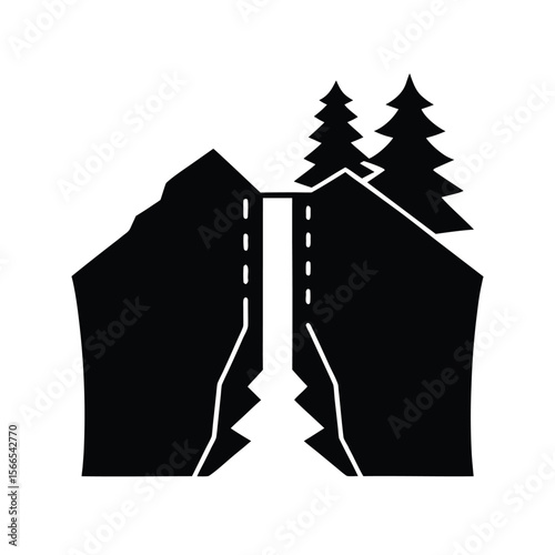 Black silhouette of waterfall between cliffs with trees