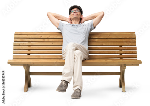 Konstfotografi Cheerful mature man in his 50s sitting on a bench with arms resting casually, looking up and smiling