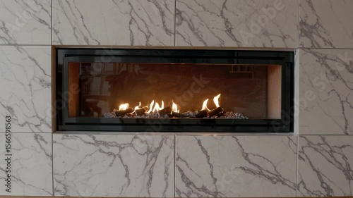 Stylish modern built-in wall fireplace with a wide horizontal design. 