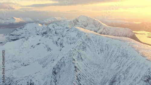The Majestic Snowy Mountains at Sunset Provide a Breathtaking View Overlooking a Serene Landscape