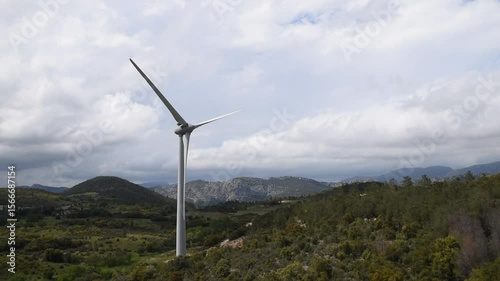 Mountain landscape with a big wind turbine