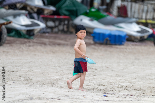 little boy running on the beach