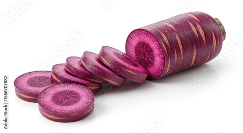 Purple carrot slices arranged beside the whole root vegetable on white