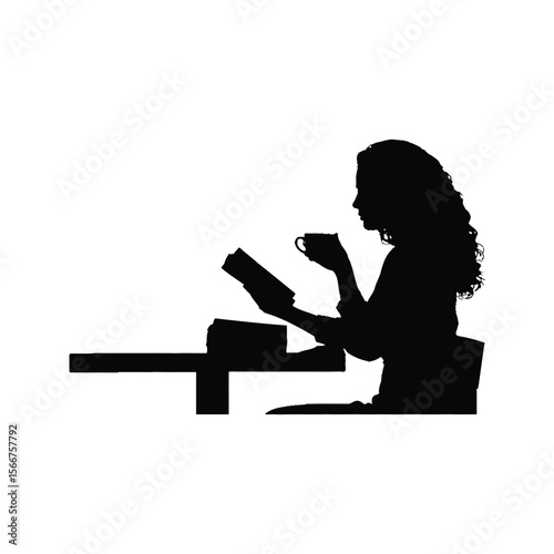 Silhouette of a woman reading a book and drinking coffee at a table