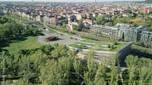 Still aerial drone video capturing the Museum of Ethnography and City Park in Budapest during morning light. No camera movement, highlighting architectural details and greenery.  