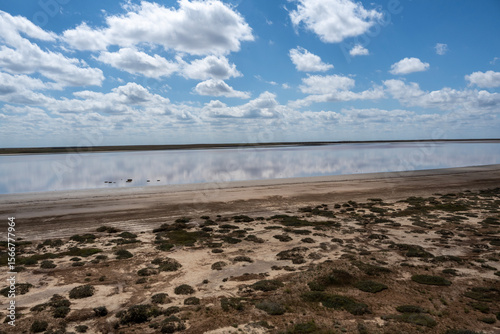 lake with clouds and sky reflected in the water
