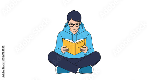 A young person wearing glasses and a blue hoodie is sitting cross-legged on the floor engrossed in reading a bright yellow book held open in their hands