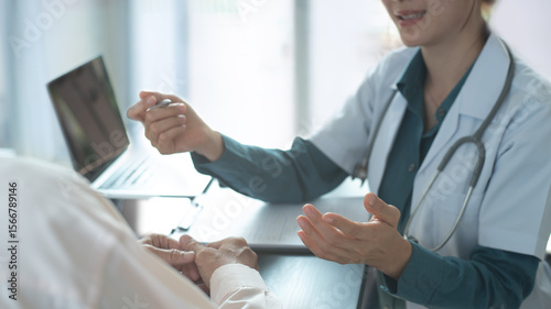 Patient and doctor at desk with support, healthcare at checkup. Female doctor and patient with consultation for medical healthcare service in hospital