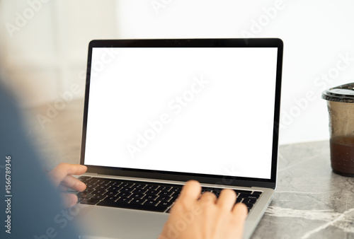 Mockup, laptop computer with blnak white screen. Person working, typing on laptop computer at home office, mockup, template for digital marketing or web design