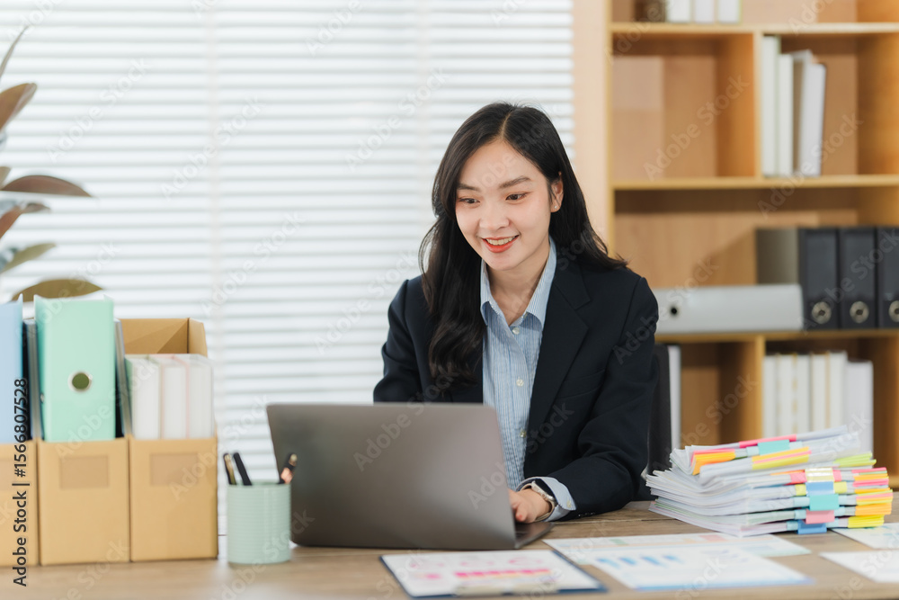 Focused Professional at Work: A focused female professional is deeply engaged in her tasks, working diligently on a laptop at her modern desk. The office setting is well-organized and calm. Focused Professional at Work: A focused female professional is deeply engaged in her tasks, working diligently on a laptop at her modern desk. The office setting is well-organized and calm.