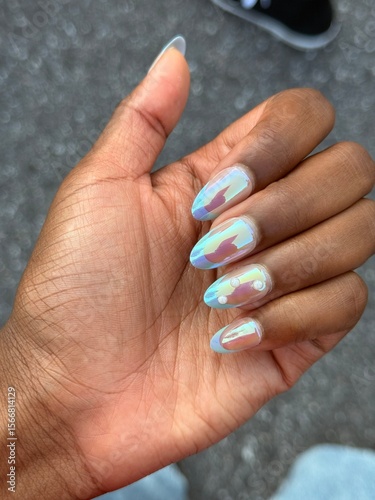 black woman's hands with reflective press on nails