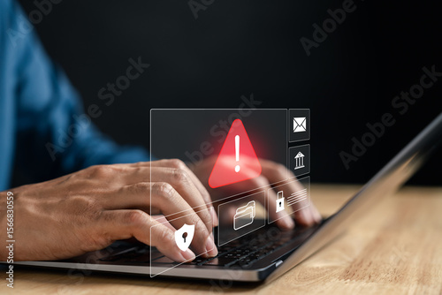 Data scam alert popup on laptop screen warning icon for online fraud, phishing attack, identity theft, security breach, internet scam, personal data risk, and cyber threat.