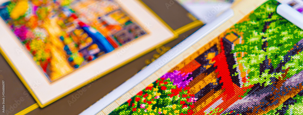 Naklejka premium Threads for embroidery. Embroidered picture. Set for beading.