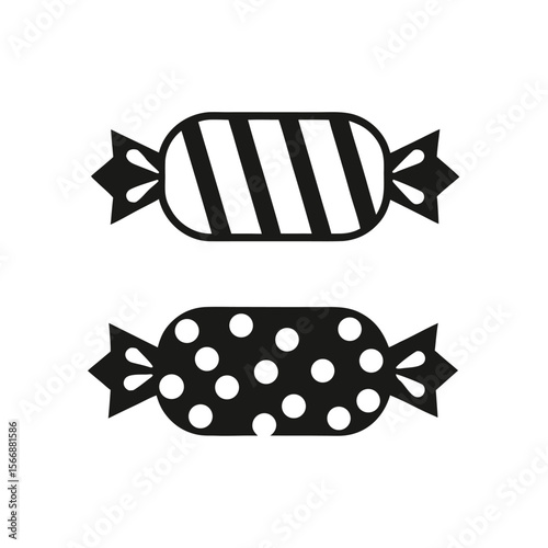 Two black candies with white patterns candy sweet
