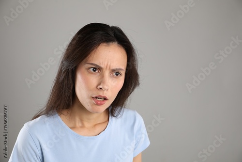 Wallpaper Mural Portrait of shocked woman on grey background, space for text Torontodigital.ca