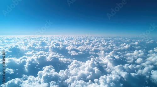 Vast Blue Sky with Billowing White Clouds: A Serene Aerial View Above the Clouds and Stretching Beyond the Horizon.