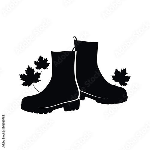 Black boots with maple leaves, fall season, autumn is around the corner