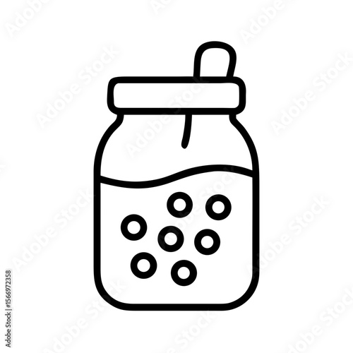 Glass jar filled with boba tea and a spoon on white background  