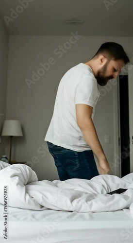Angry man shouting in frustration gripping hair looking at cellphone. Stressed adult reacting to shocking message or error on smartphone device.

