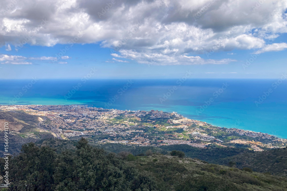 Fototapeta premium Panoramic view unfolds from the scenic hiking path leading to Mijas peak, showcasing the stunning landscapes of Andalusia, Malaga, Spain